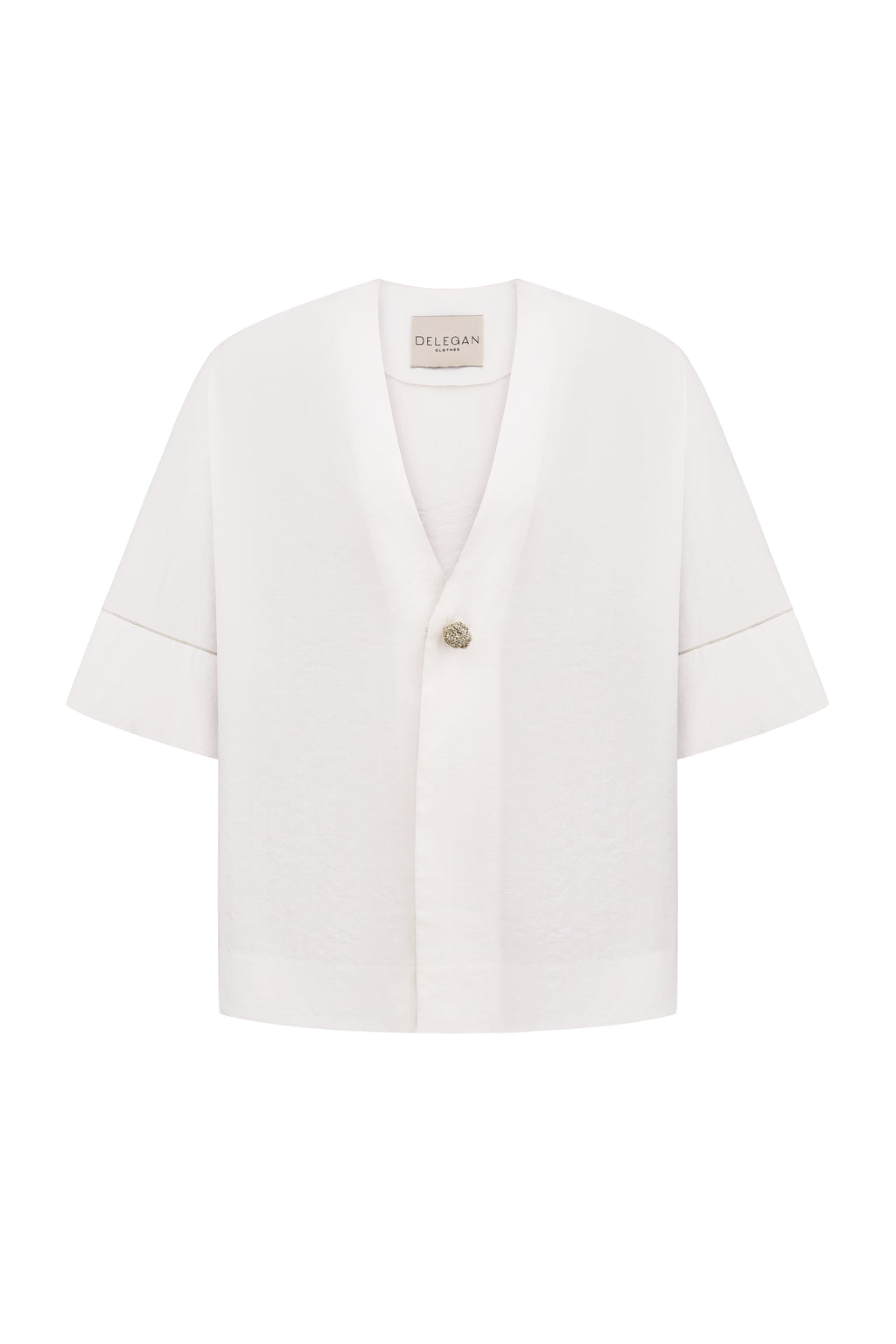 Shirt with a knitted gold button