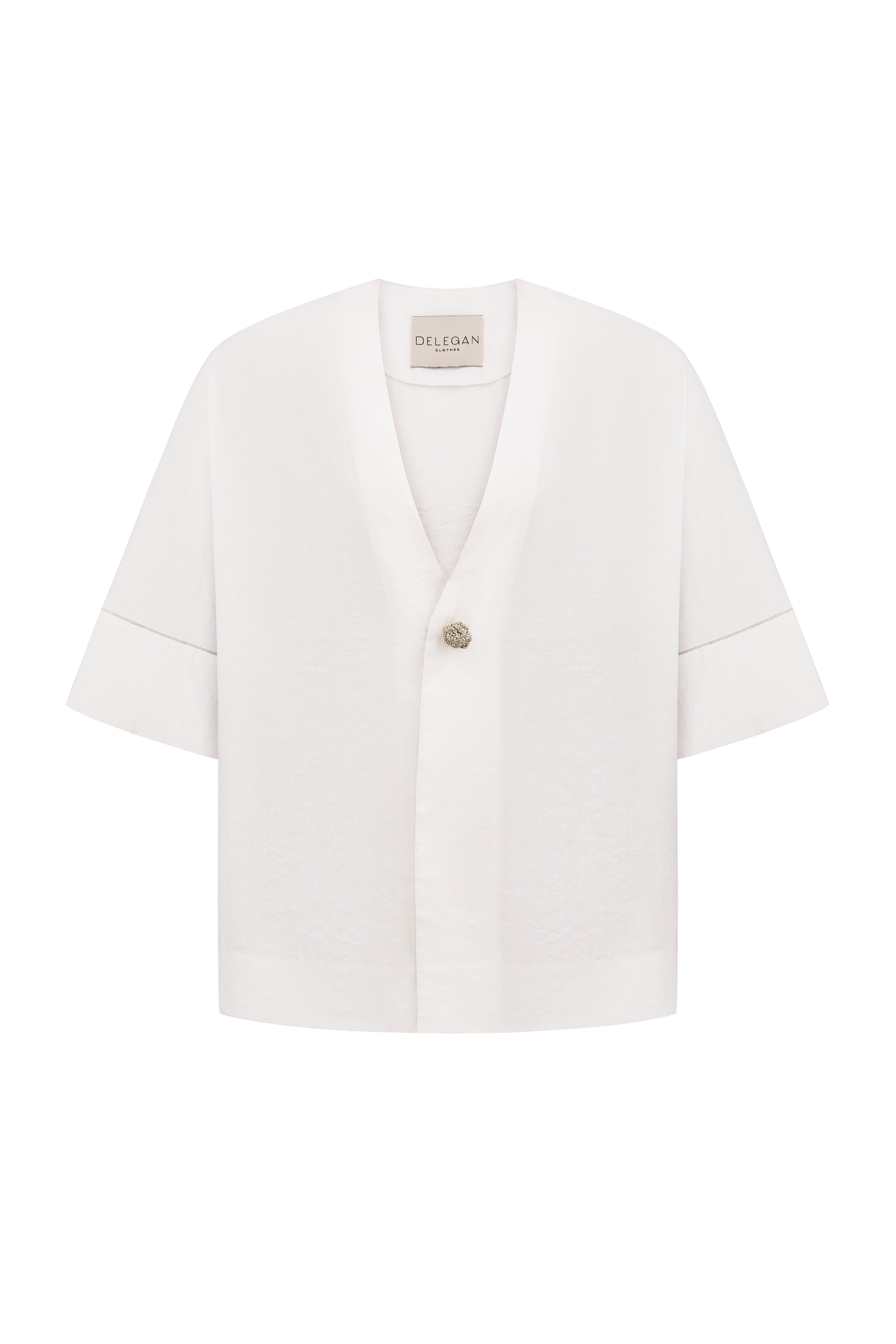 Shirt with a knitted gold button