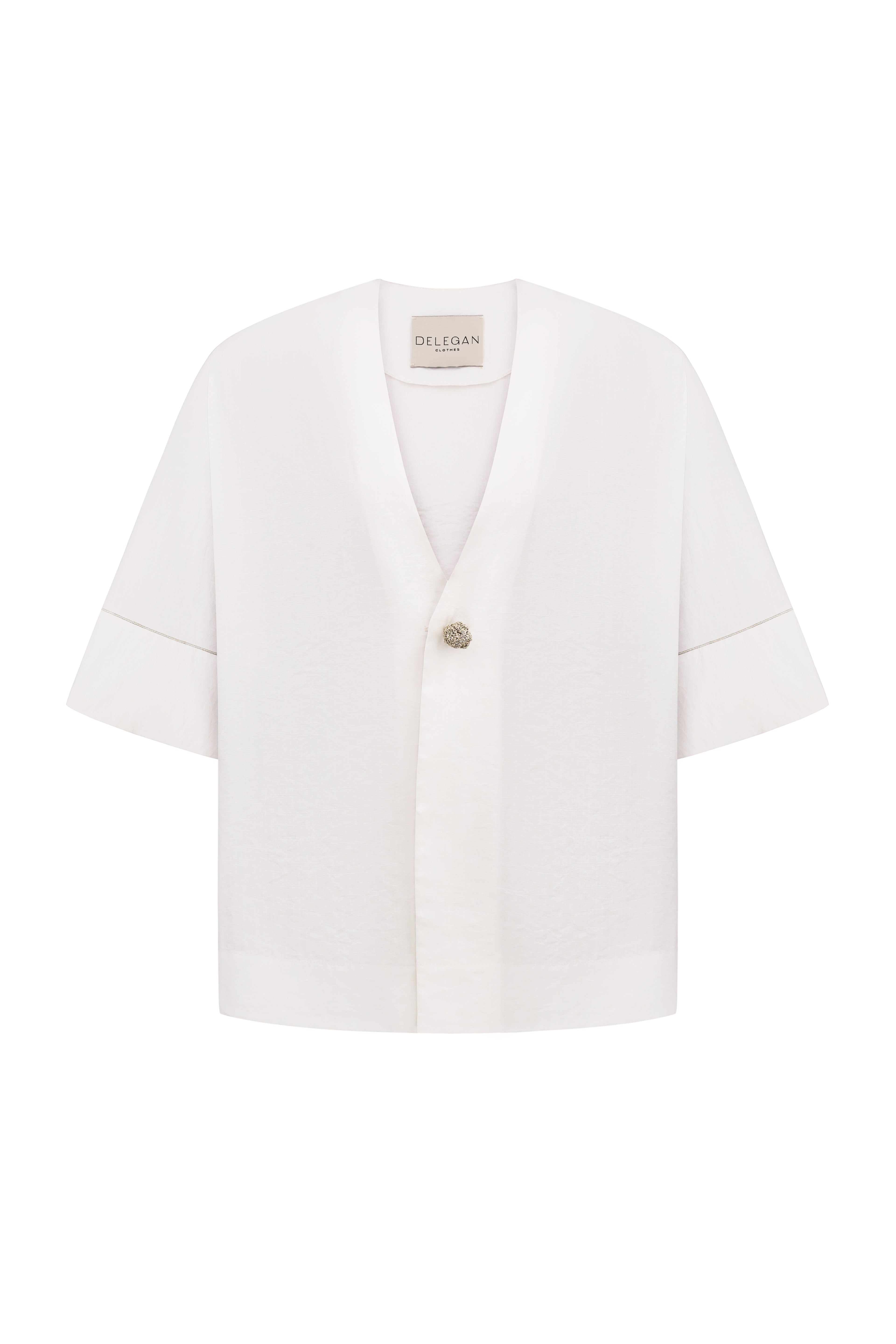 Shirt with a knitted gold button