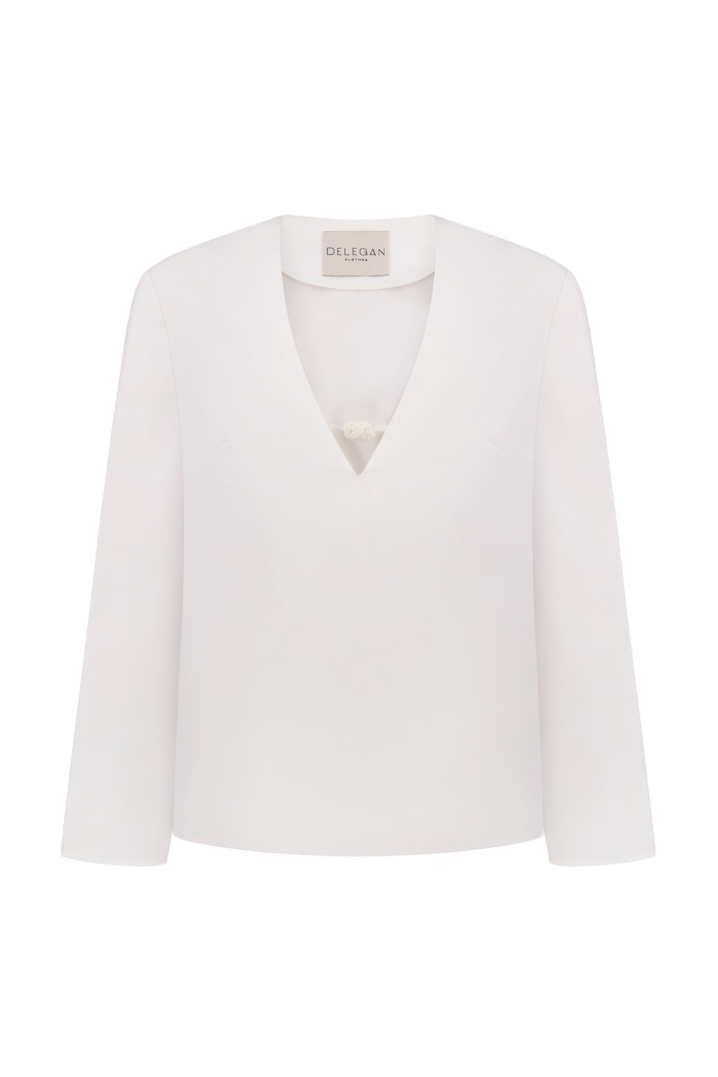 Shirt with a knitted button