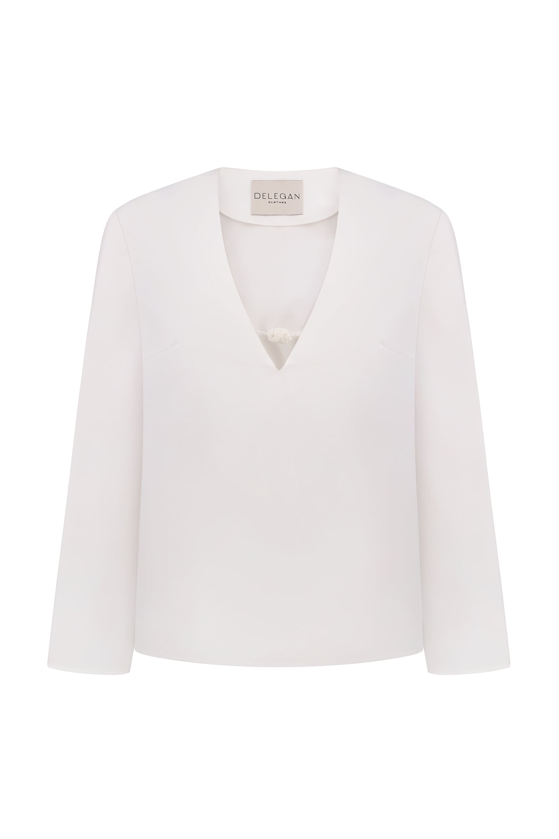 Shirt with a knitted button