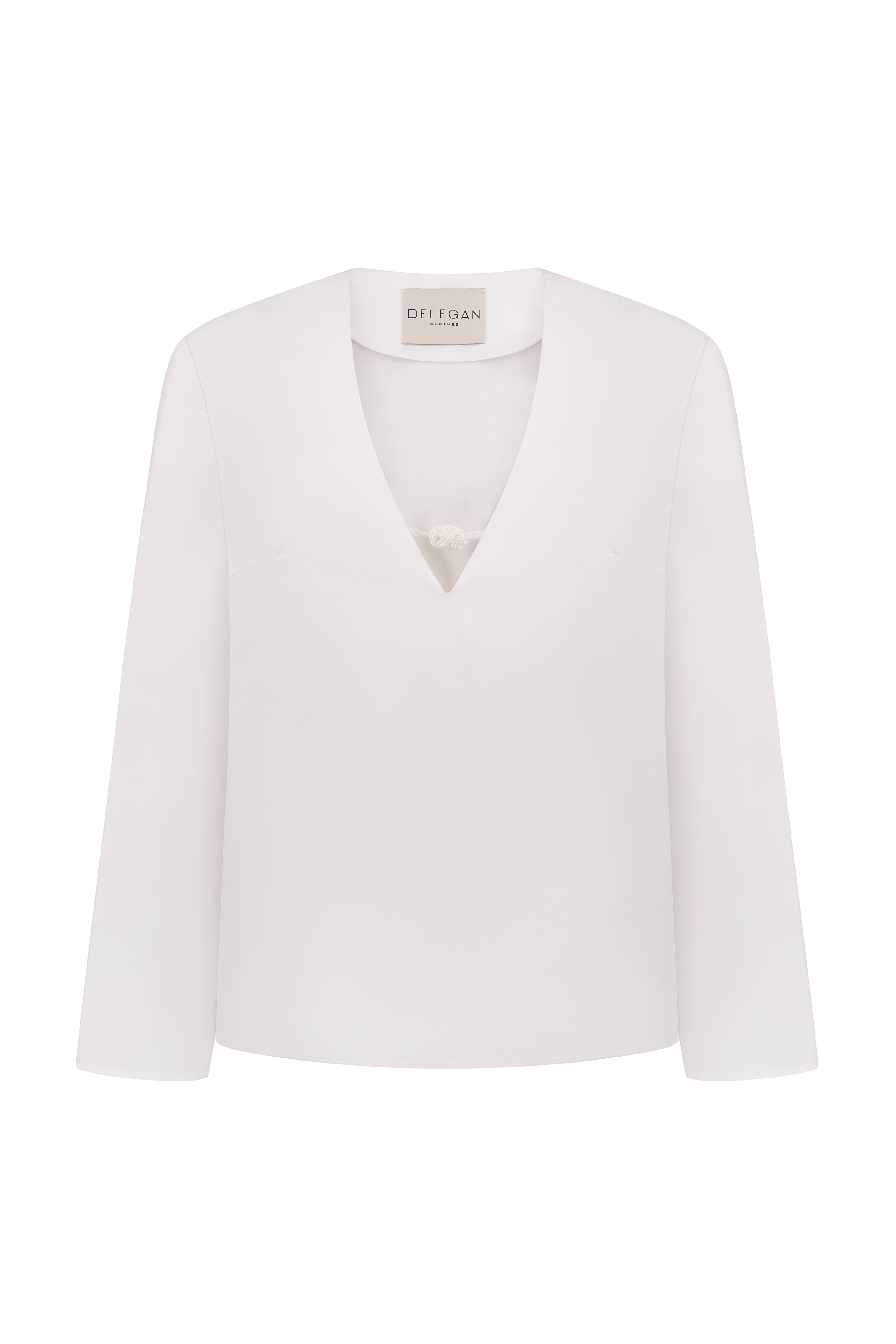 Shirt with a knitted button