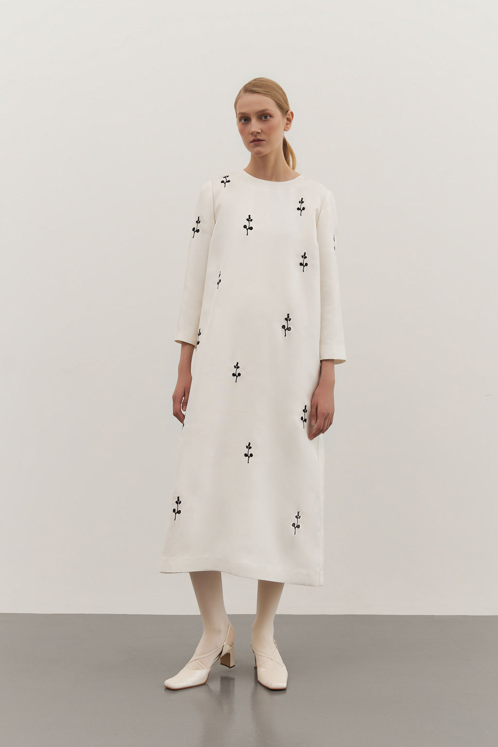 IVORY DRESS WITH ORNAMENT