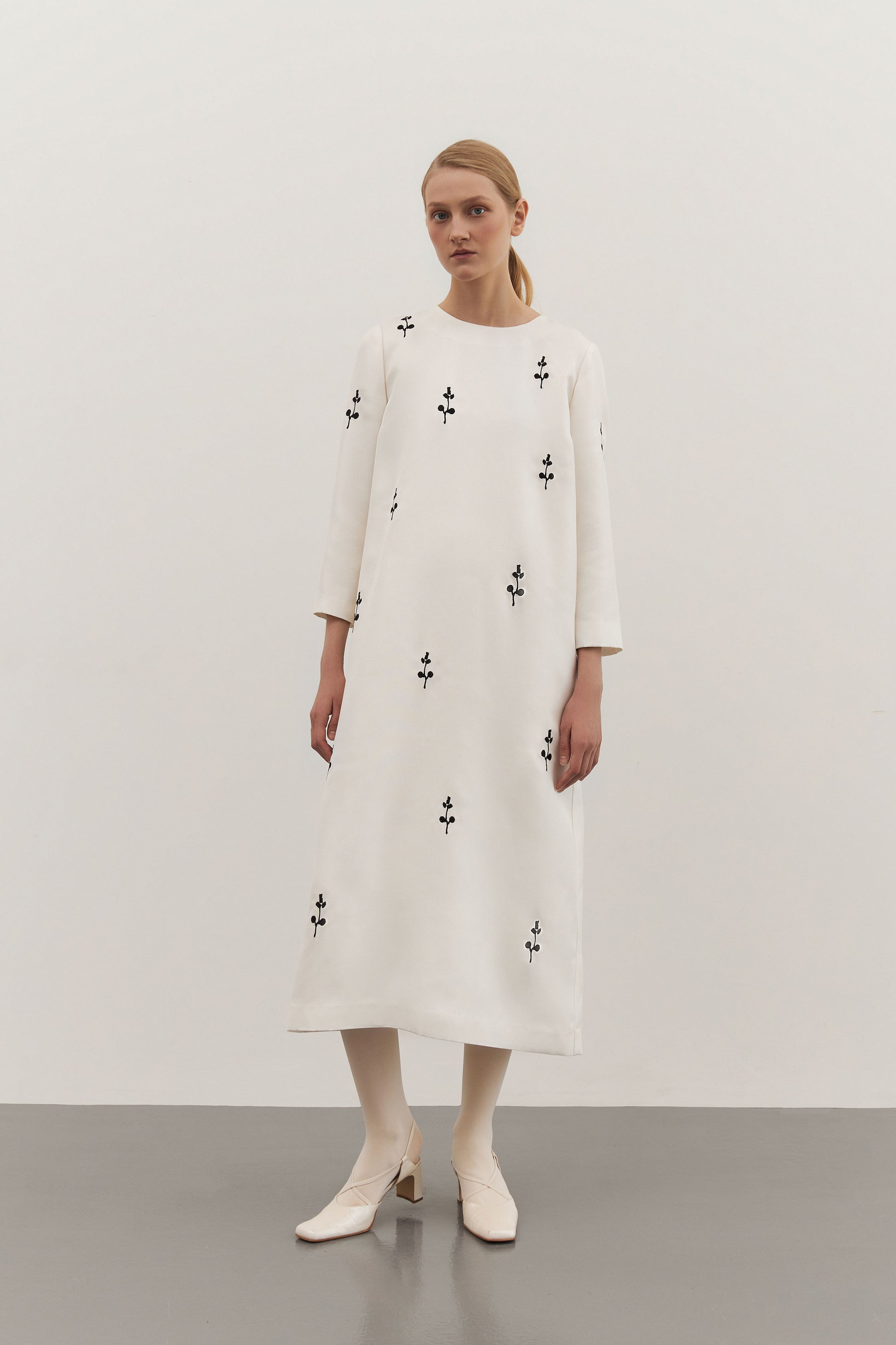 IVORY DRESS WITH ORNAMENT