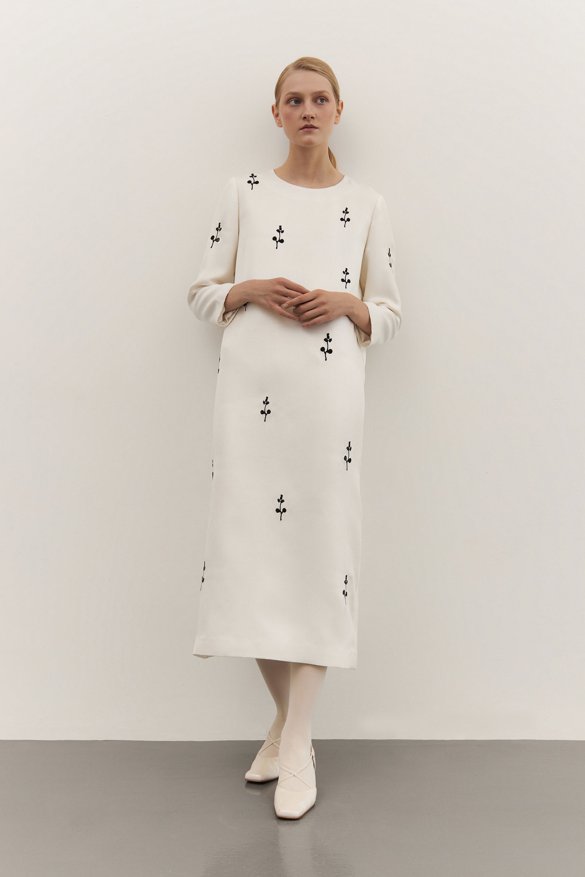 IVORY DRESS WITH ORNAMENT