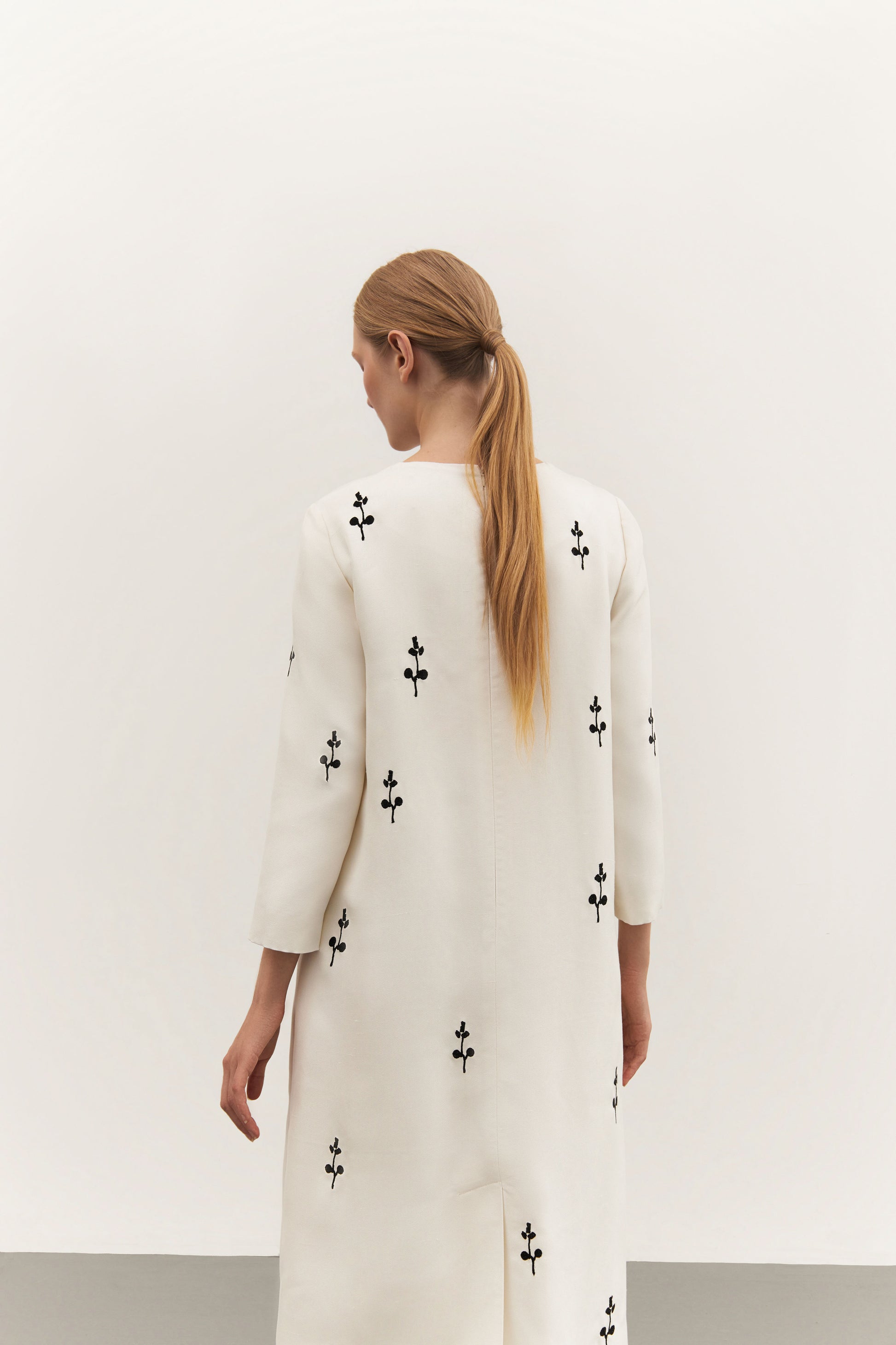 IVORY DRESS WITH ORNAMENT
