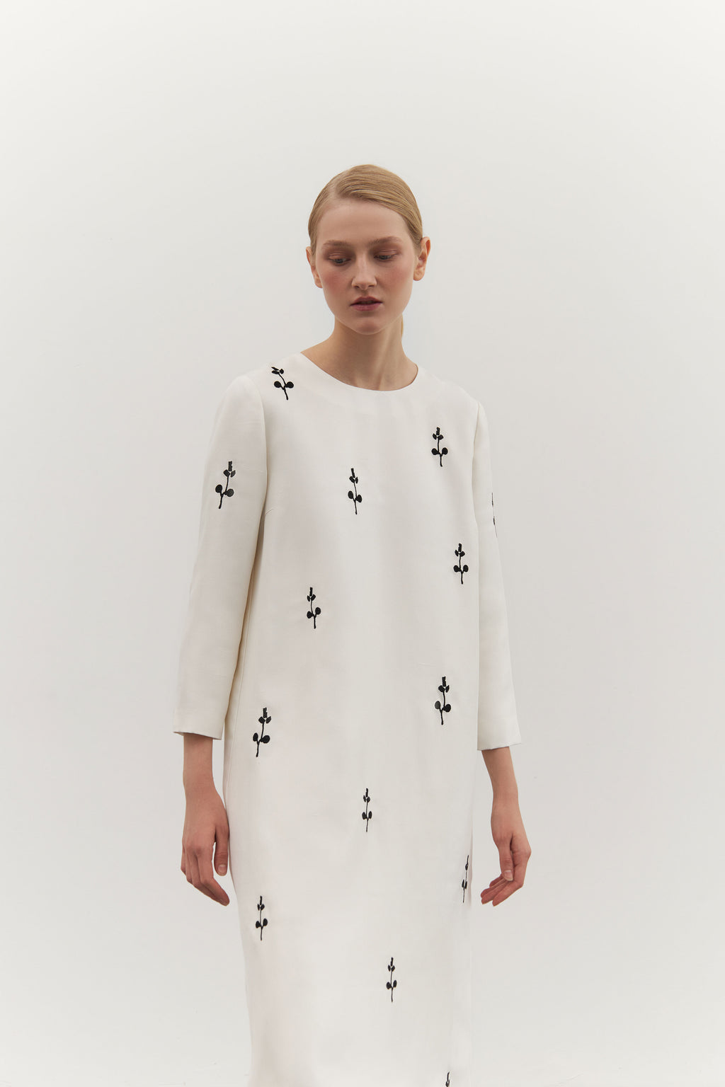 IVORY DRESS WITH ORNAMENT