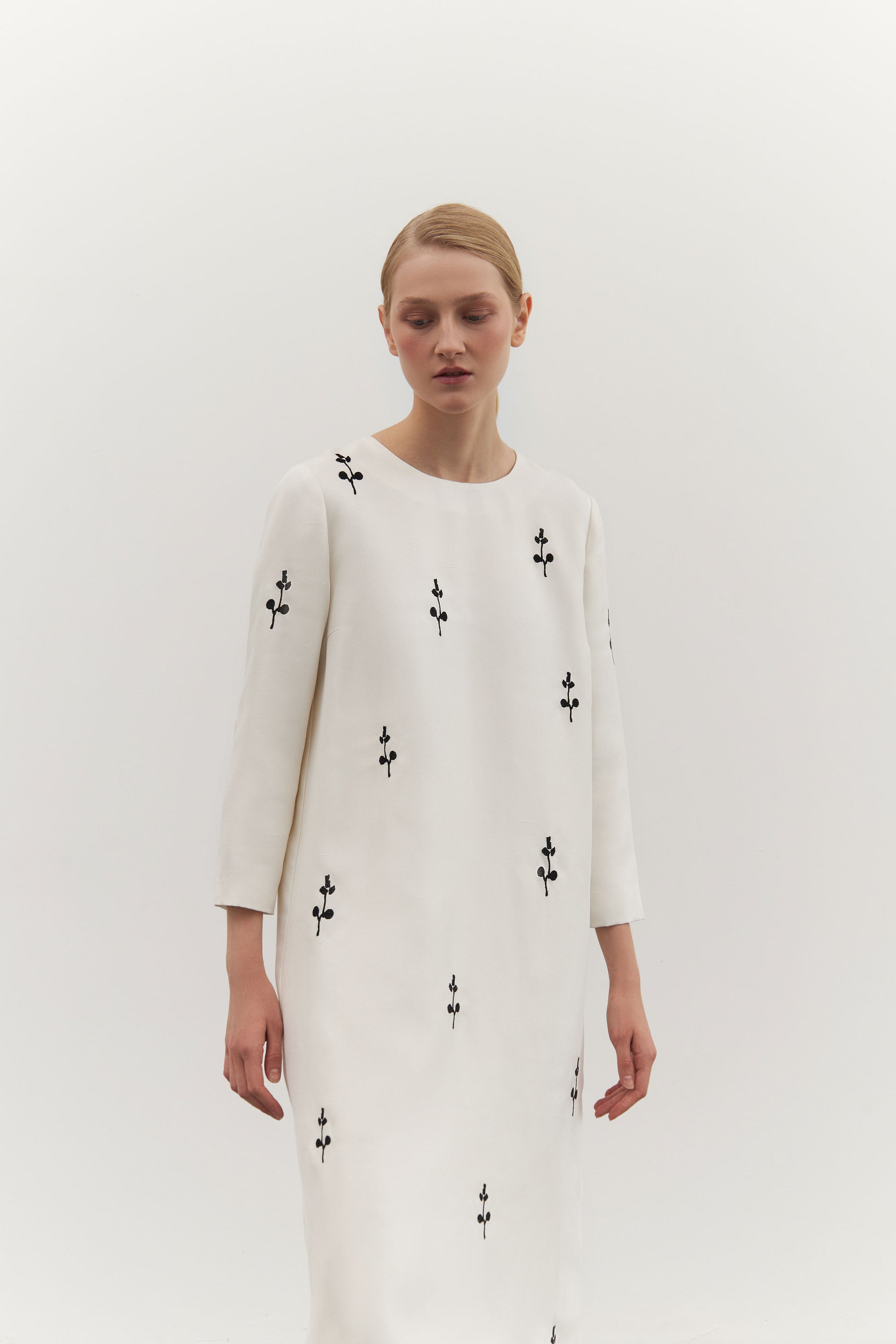 IVORY DRESS WITH ORNAMENT