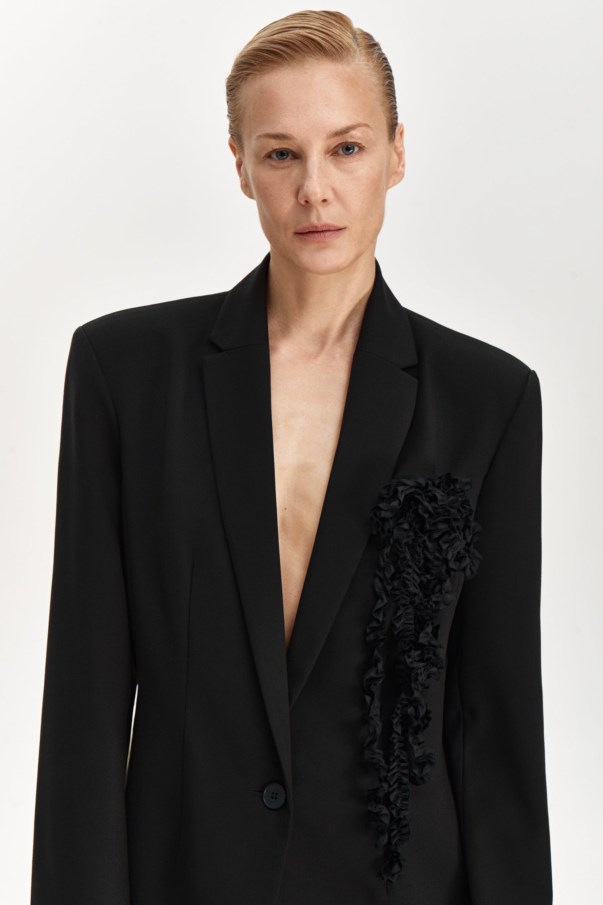 Jacket with brooch