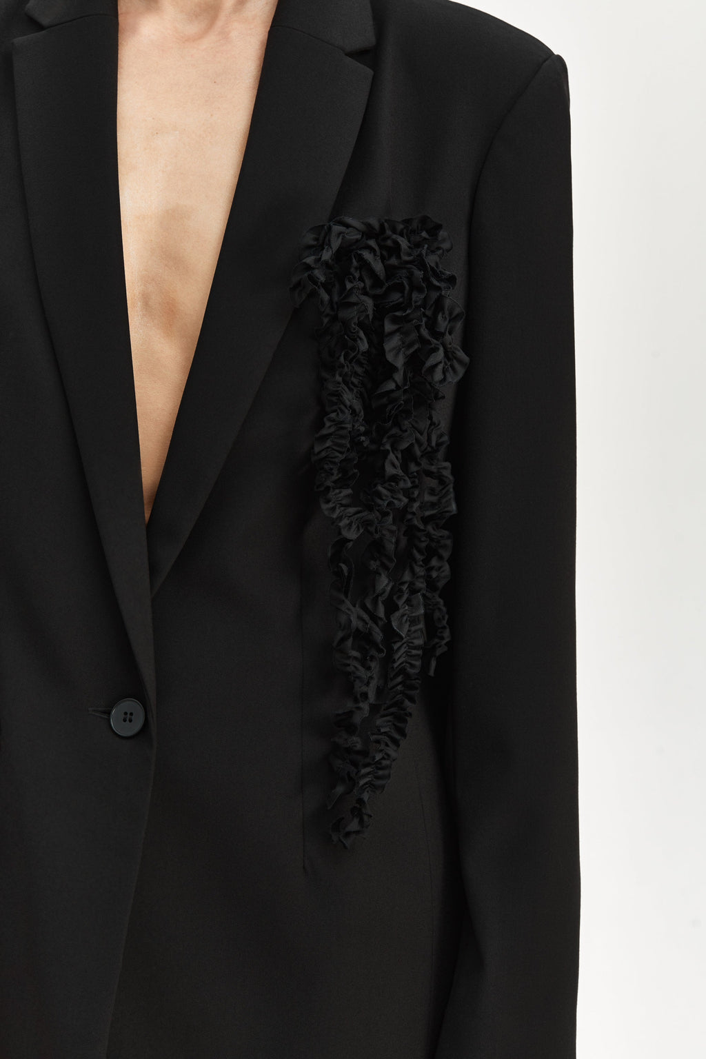 Jacket with brooch