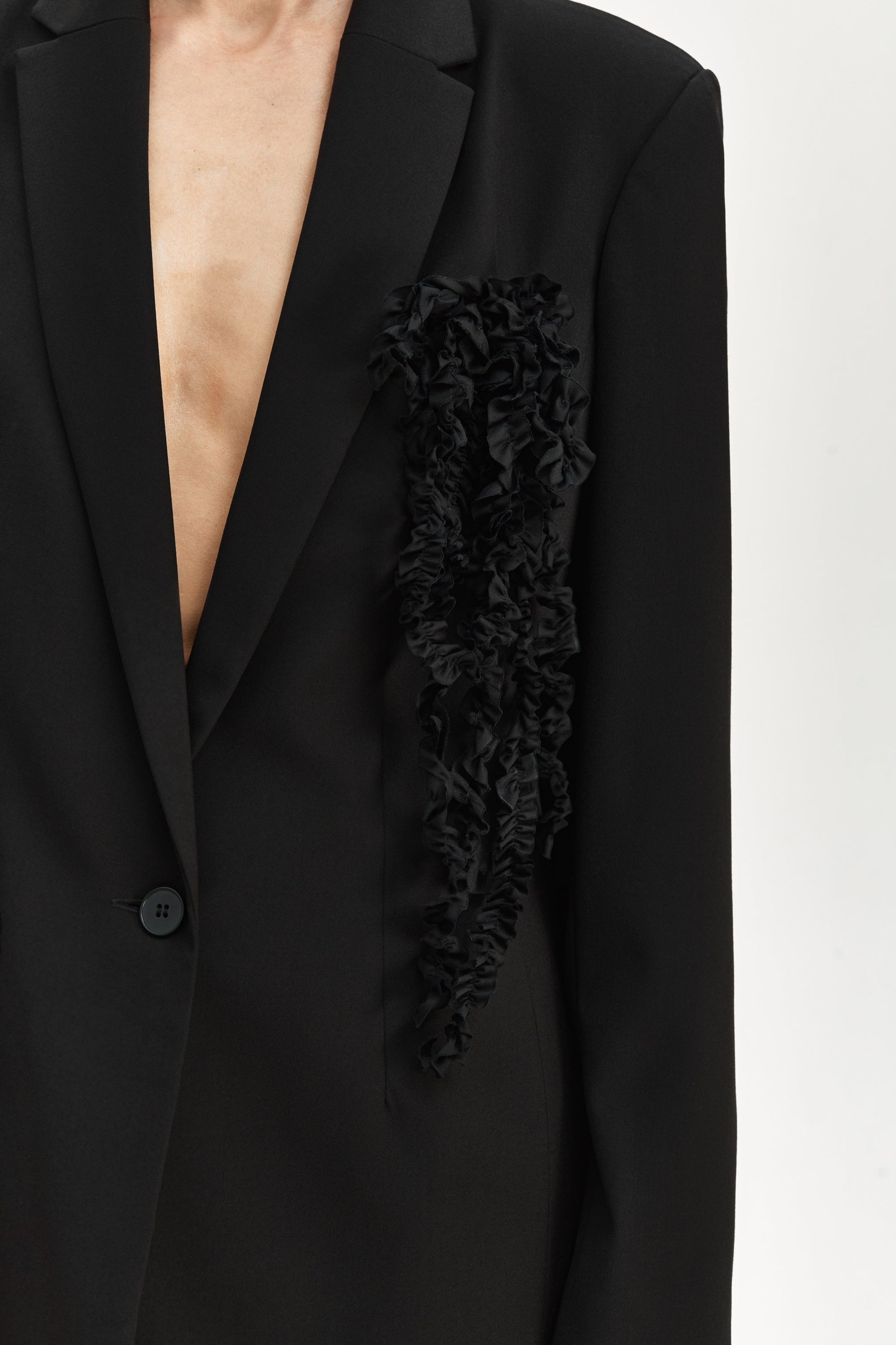 Jacket with brooch