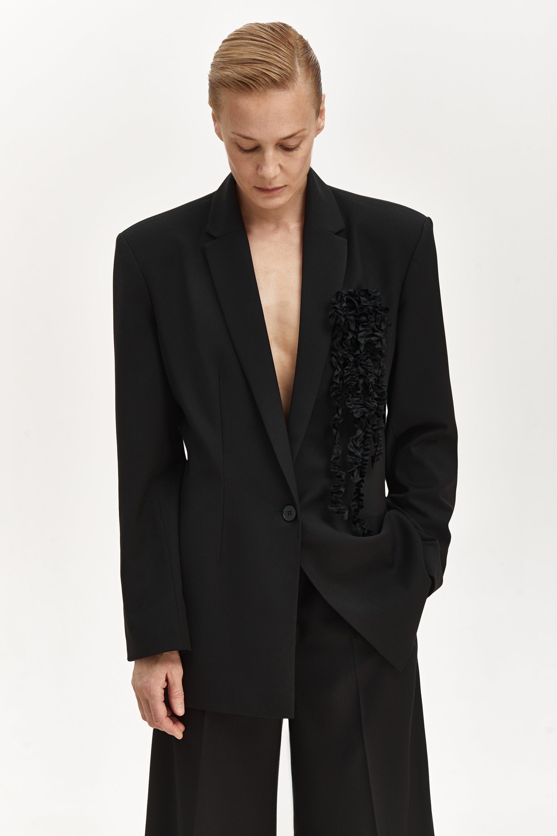 Jacket with brooch