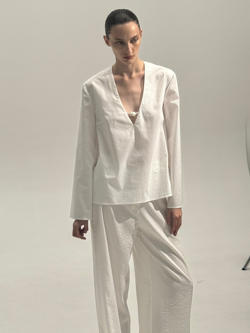 Shirt with a knitted button